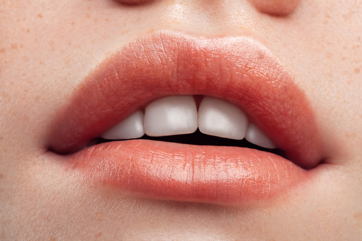 Part of woman’s face. Woman’s lips and nose. Soft skin.