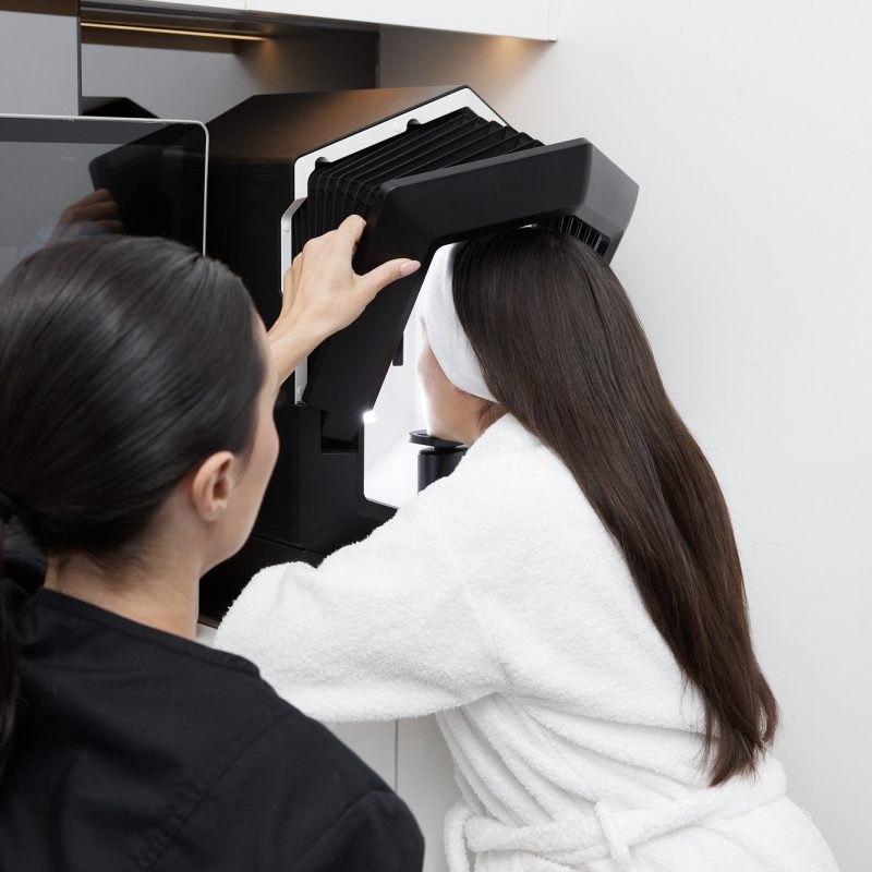 Client undergoing advanced skin analysis at Body Sculpting Clinics Sydney to identify pigmentation, dehydration, and other skin concerns.