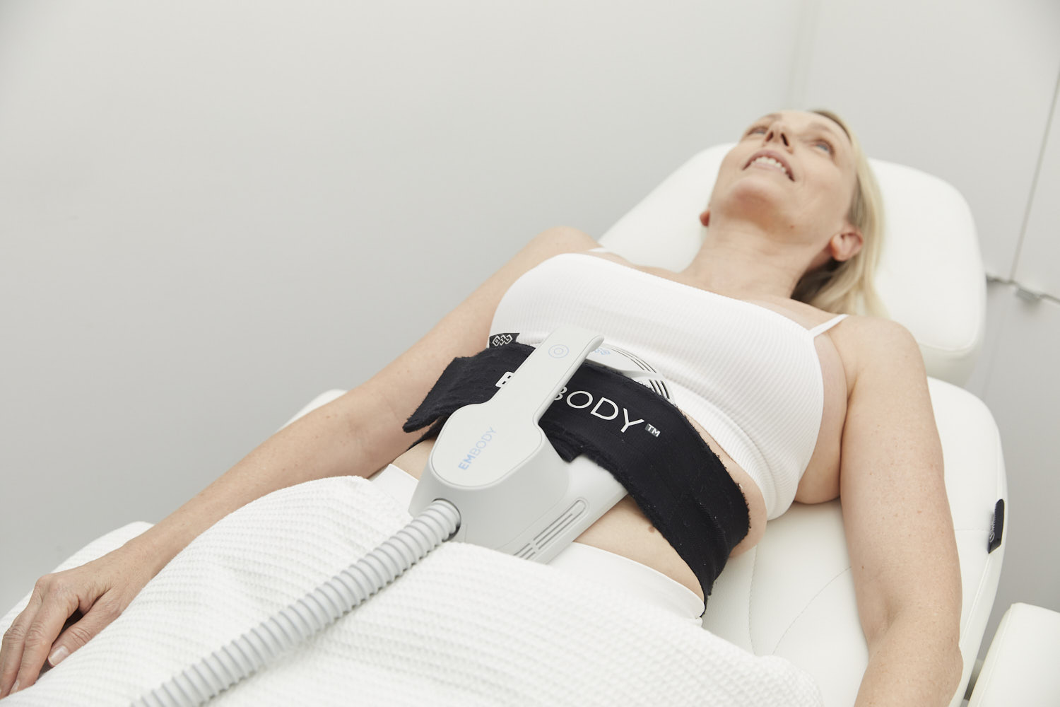 EmBody device delivering muscle stimulation to abdominal muscles.
