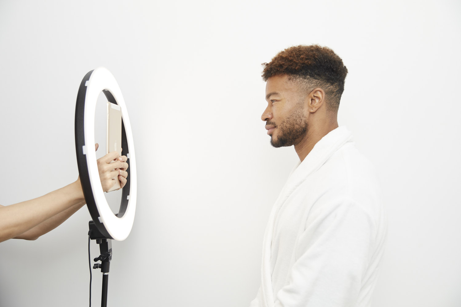 Client at a body sculpting clinic in Sydney posing for a professional before-and-after tracking photo.