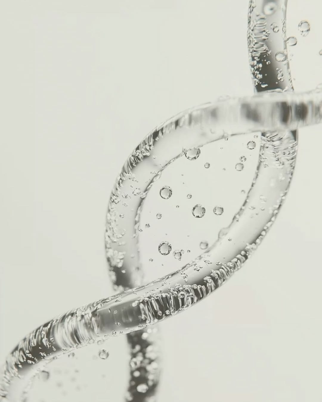 Clear, gel-like double helix structure representing DNA repair and peptide science in skincare.